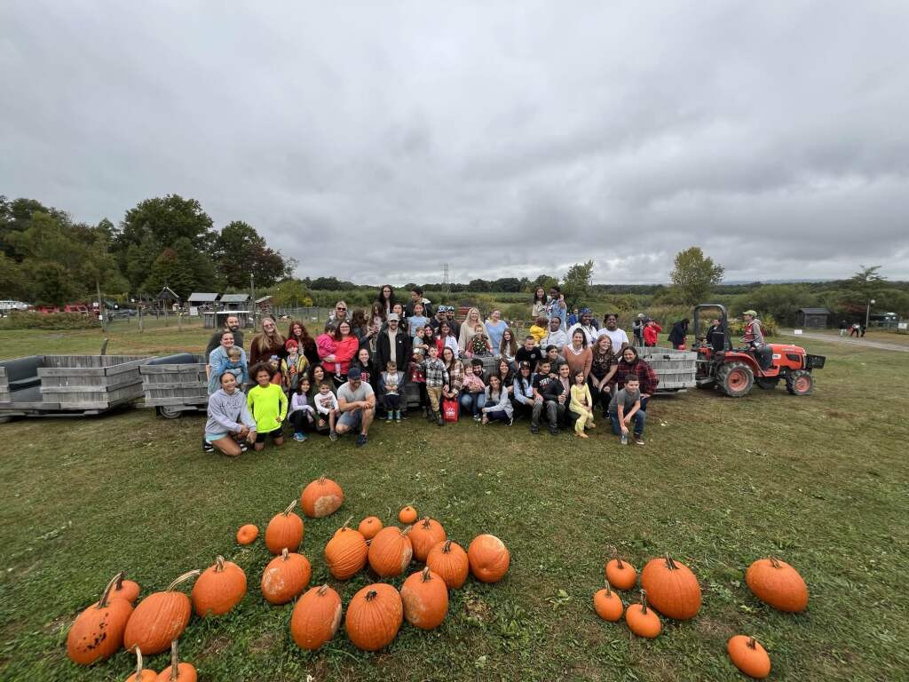 Employees + Family Apple Picking for the company's quarterly event hosted in September 2024.