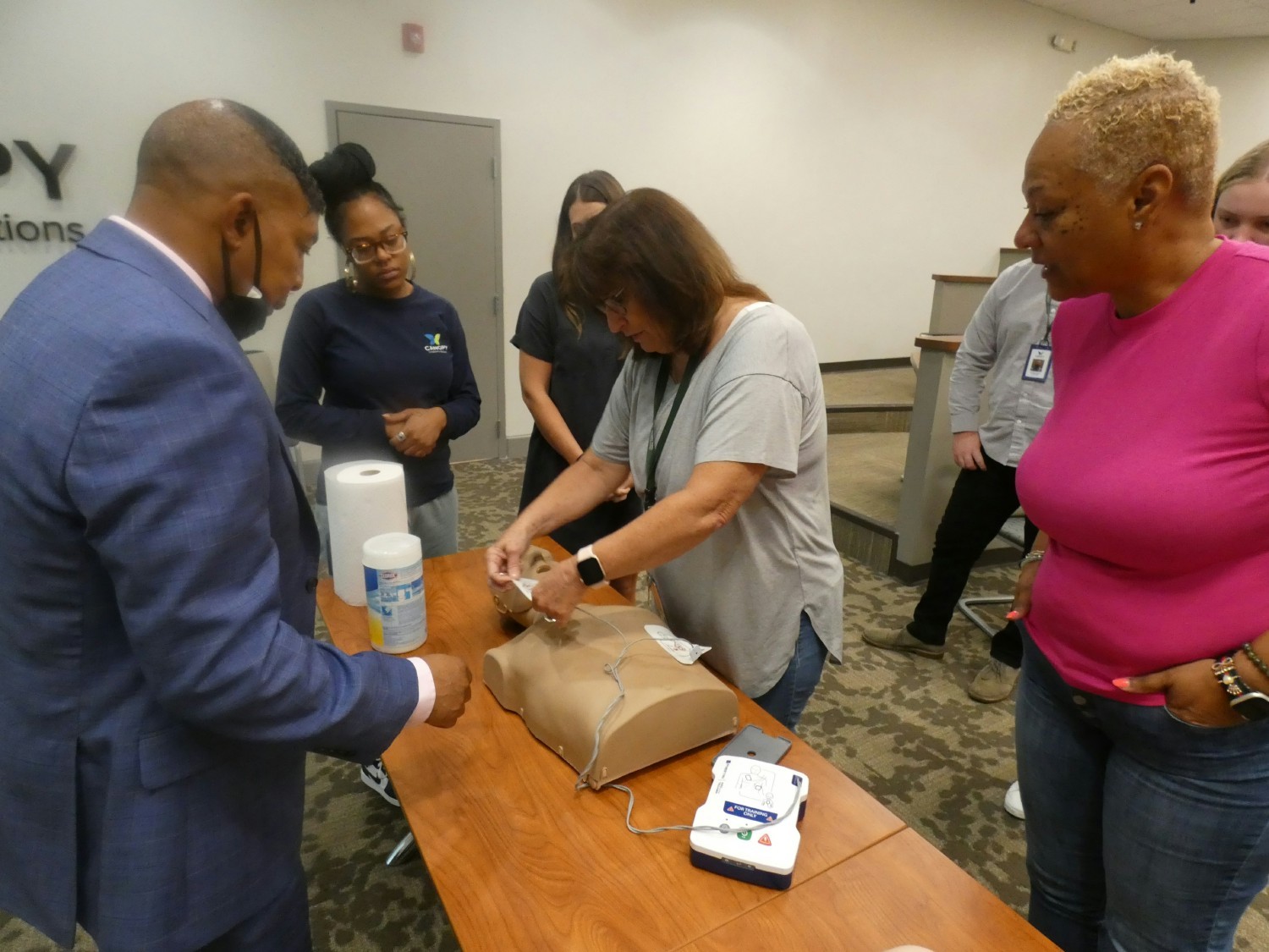 Canopy employees receiving hands-on training in CPR.