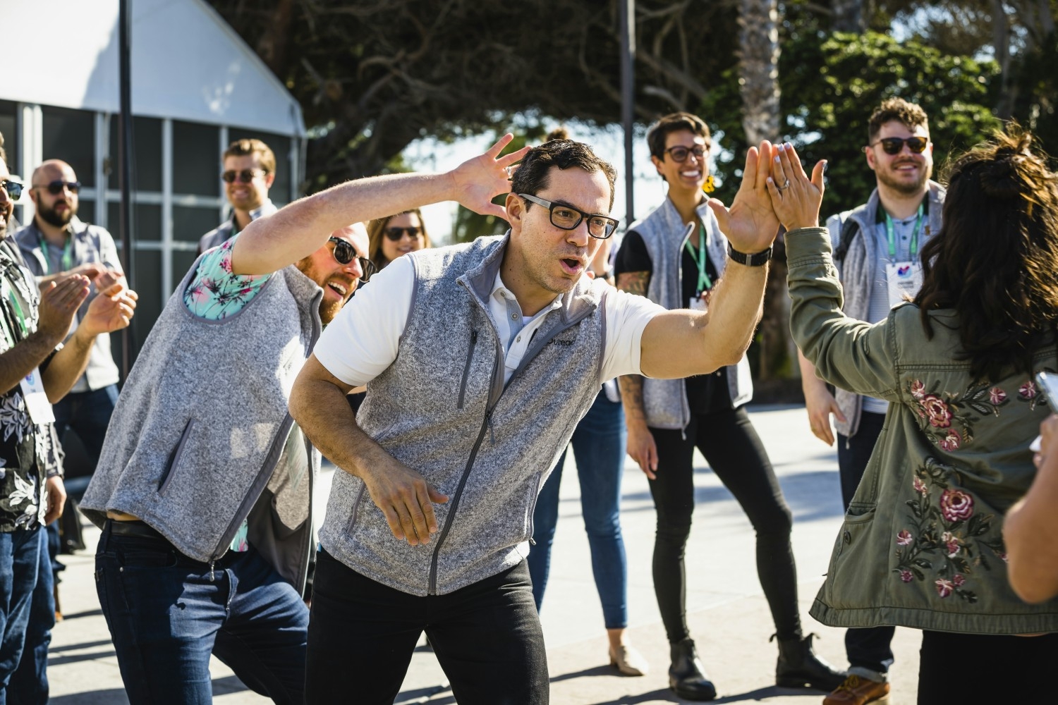 Outreach CEO and cofounder, Manny Medina, greets attendees in the high five tunnel at the Unleash conference. 