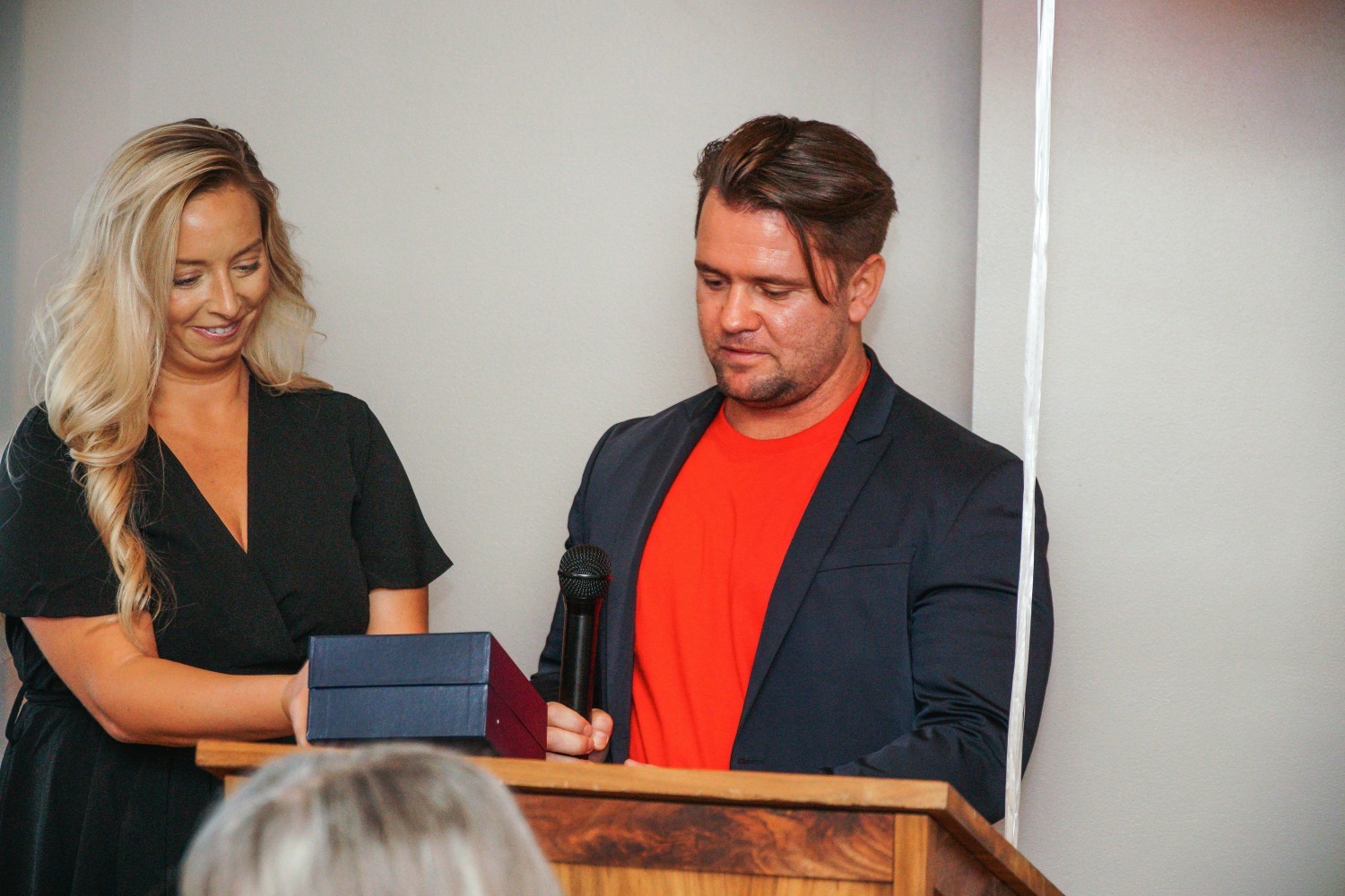 Samantha Cook receiving the annual Soaring Phoenix of the year award from COO, Tyler Crockett. 