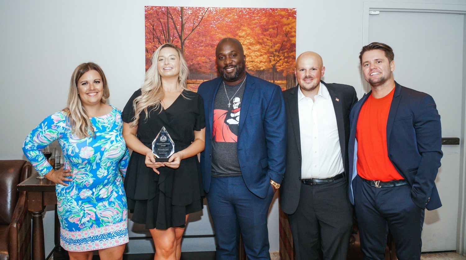 Crimson Phoenix Executive Team with Sam, Nicole Schwab, Samantha Cook, Gerald Walker, Brad Becker, and Tyler Crockett