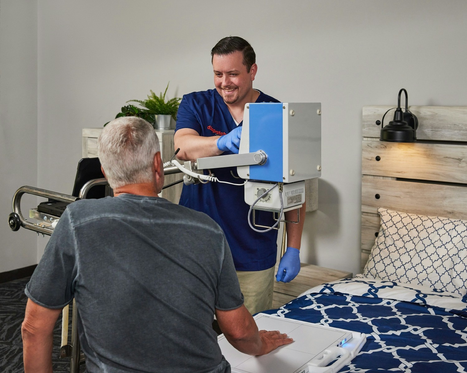 DispatchHealth team member taking an x-ray in comfort of home.