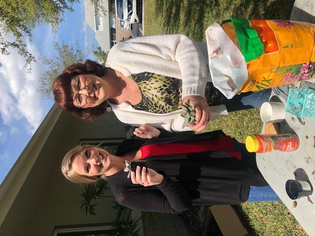 Cori Kawa and Lee Granmaison planting succulents for #plantaflowerday 