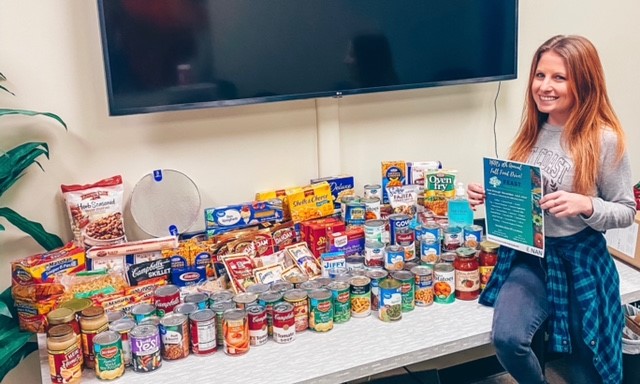 Marketing Director - Ashley Griffin with Nanner donations for the local food pantry. 