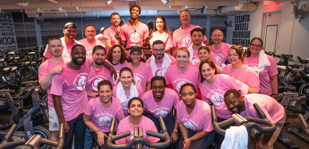 CLA clients and family members make time for their physical and mental health by attending a cycle class together.