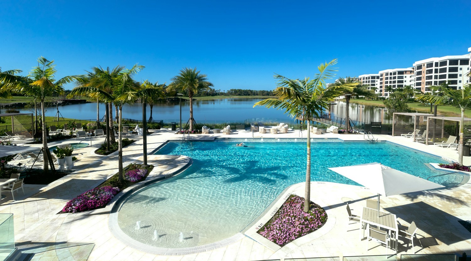 Gorgeous pool, lake and golf course vistas from Moorings Park Grande Lake’s spectacular Clubhouse.