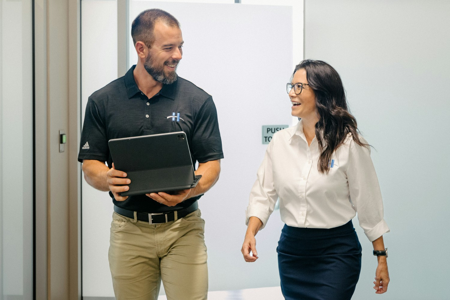 The leaders of our UKG Practice collaborating and sharing a laugh together.