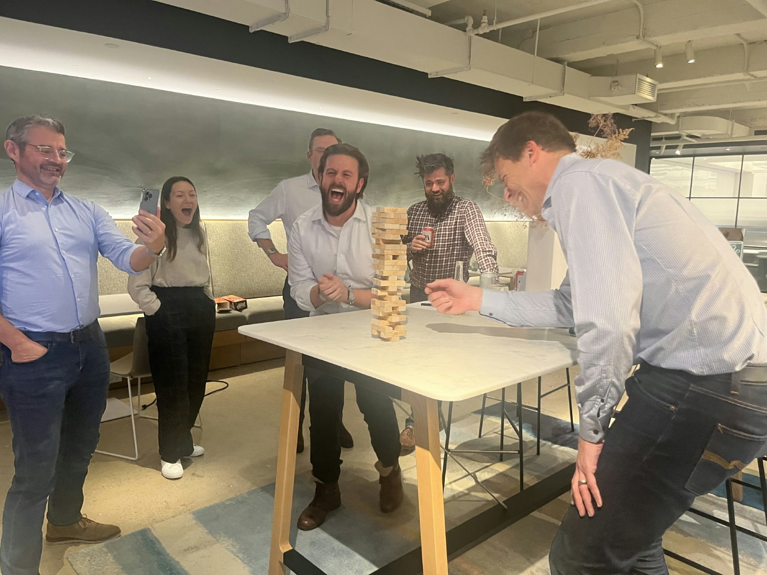 The Berkeley Partnership employees play a Jenga game to foster some healthy competition in our new office! (5th Av. NYC)