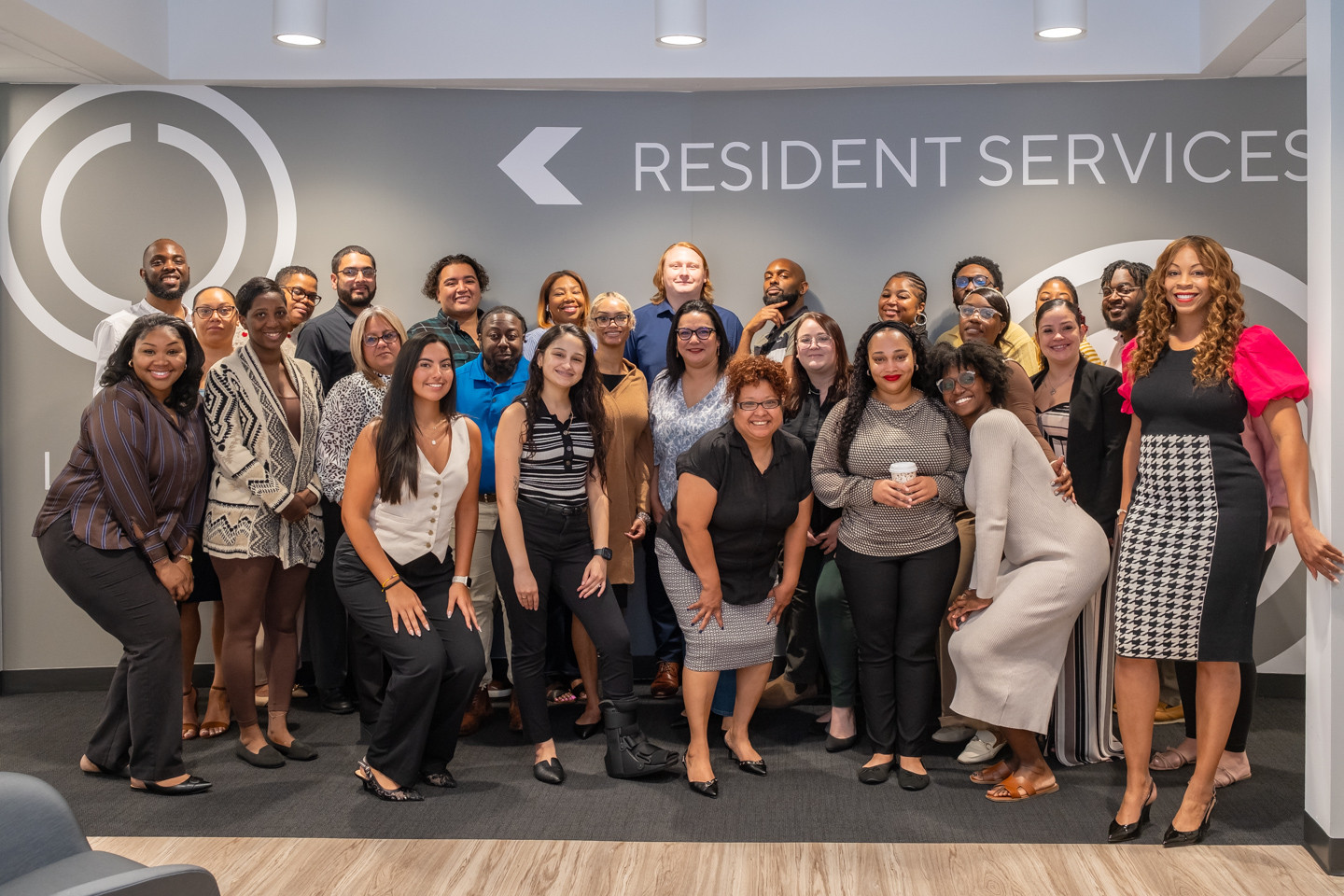 Associates in our Resident Services group celebrate their new office space.