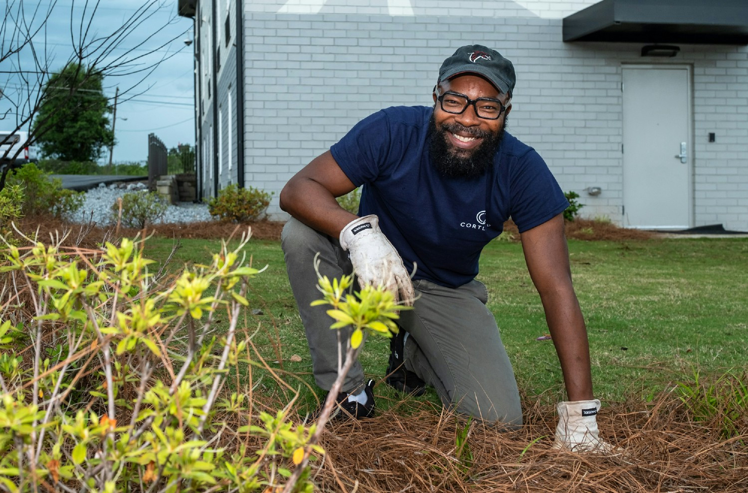 Cortland Sr. Architectural Project Mgr., Julian Lemon gives back by planting a garden during Cortland Commitment Week.