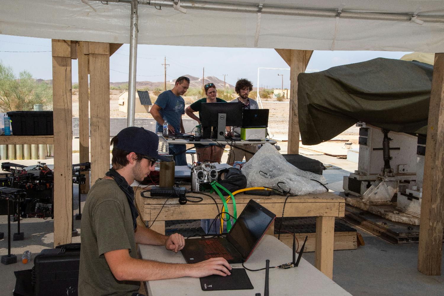 Our CEO working with the engineers during a drone field test in the Arizona desert.