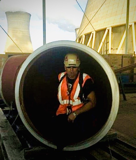 One of our employees sitting in a pipe that he was about to weld!