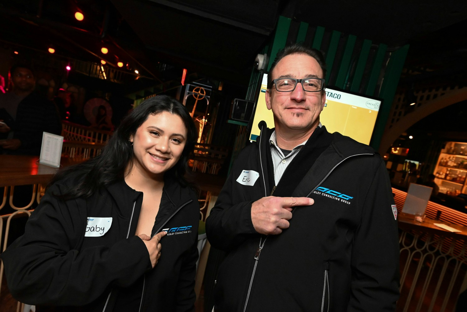 ACG Team members showing off their new company swag! 