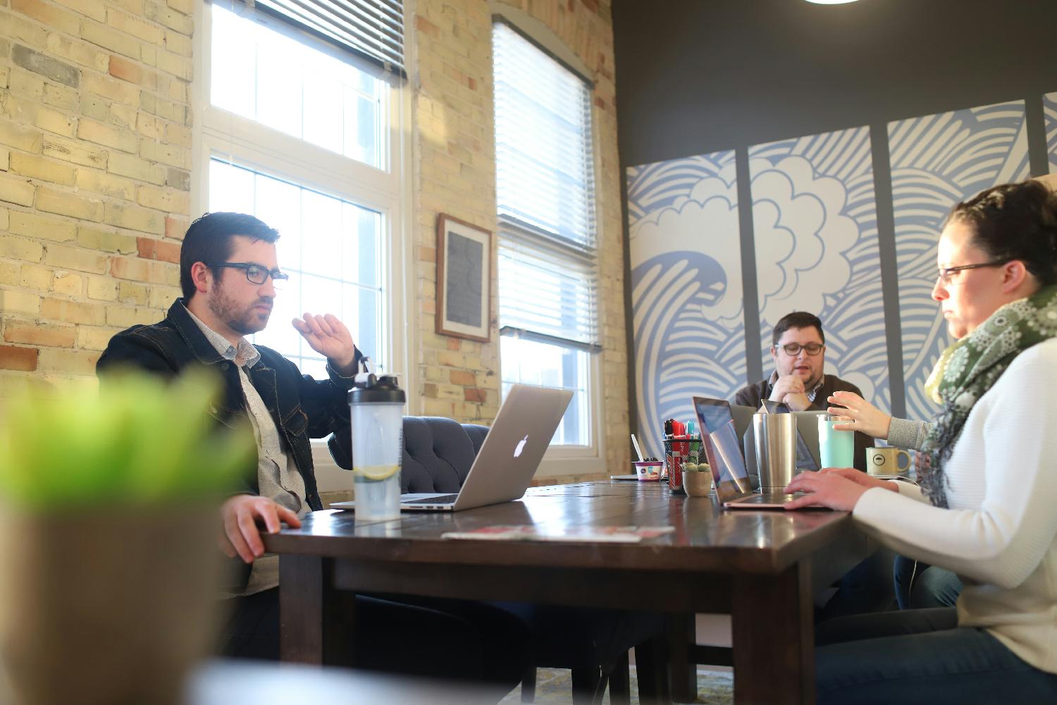 Working session around the company conference table.