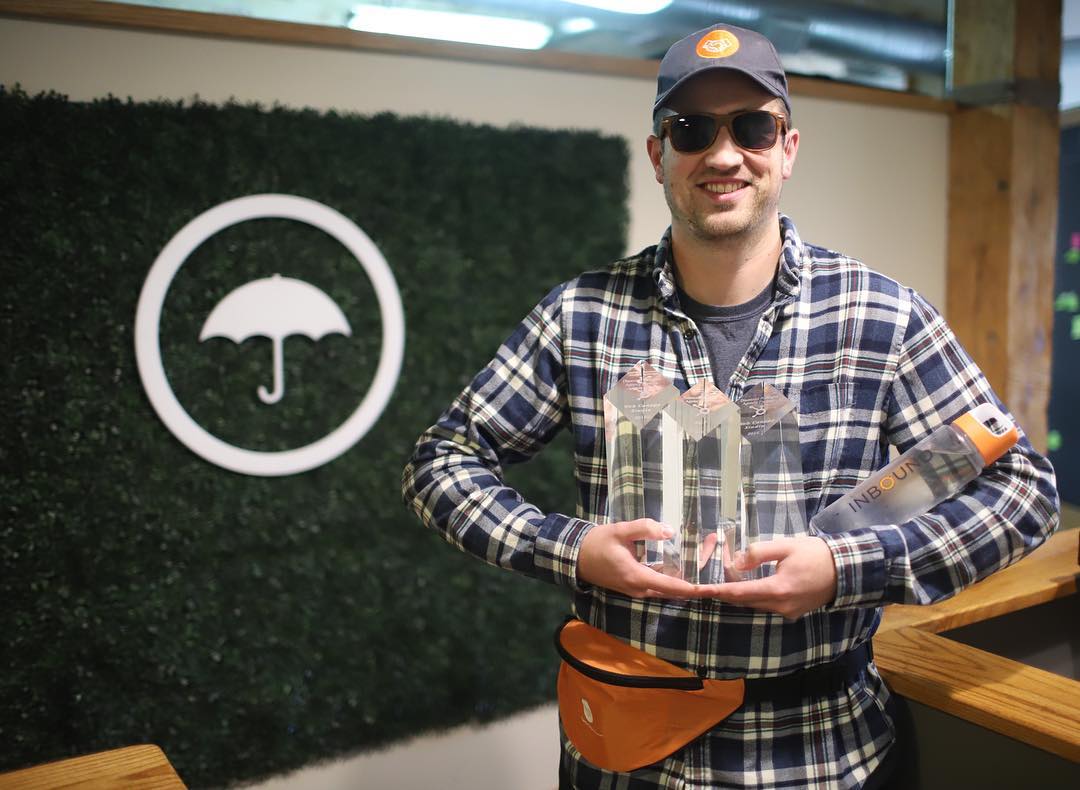 Tim showing off some of our recent HubSpot Impact Awards.