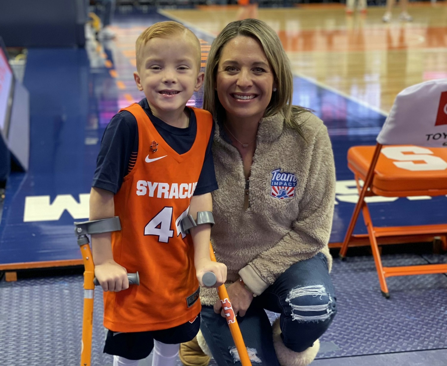 Team IMPACT Staff Member Lynn with a child in the program. 