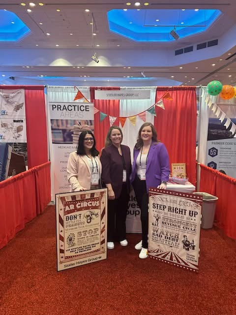 Three members of the SHG Team exhibiting at an industry conference. 