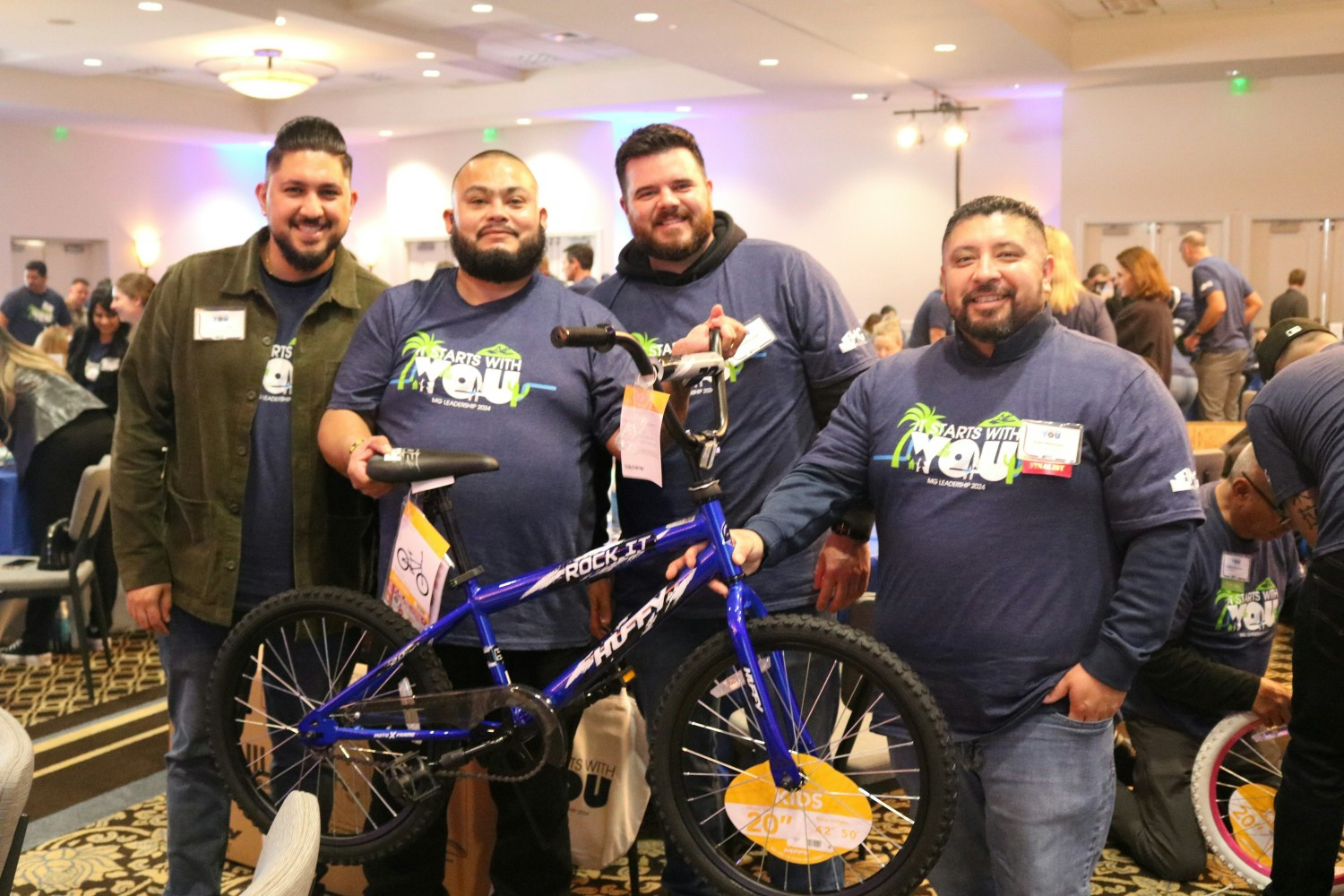 MG team members build bicycles for foster children during the annual Leadership Conference. 