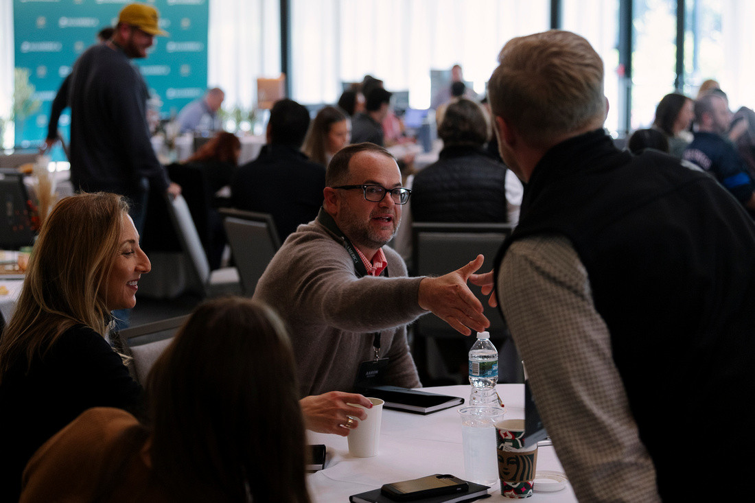 AgAmericans greeting each other at the annual AgAmerica Retreat. 
