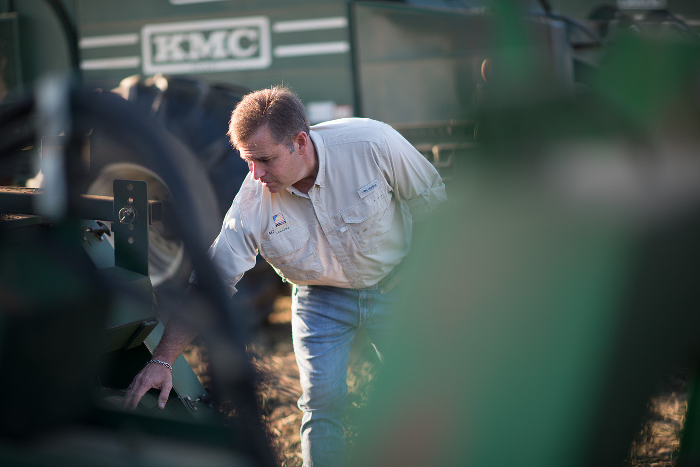 An AgAmerican exploring farm equipment during a farm visit. 