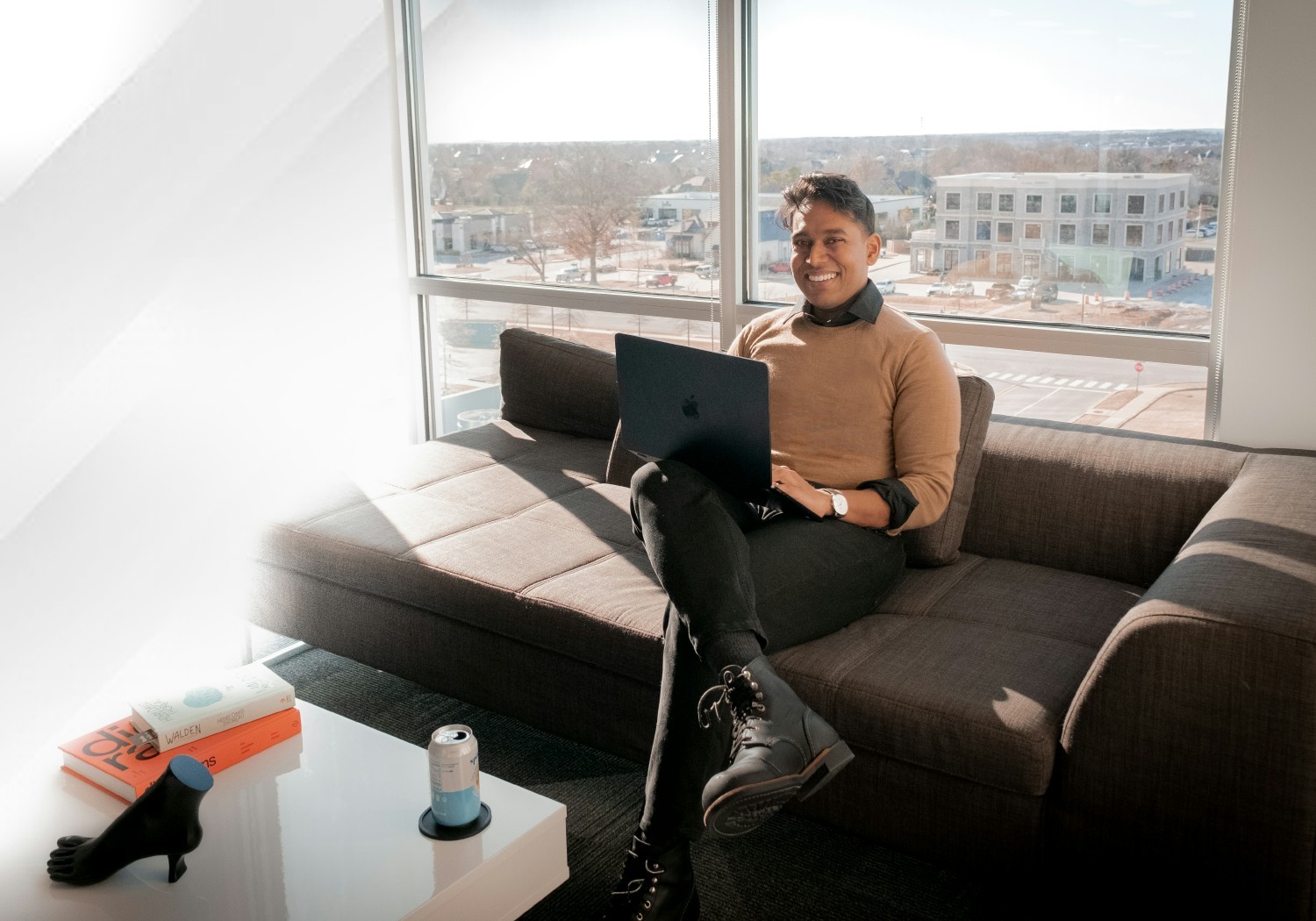 Our CEO, TJ, spends a lot of time working alongside our team members - His office includes cozy couches for co-working!