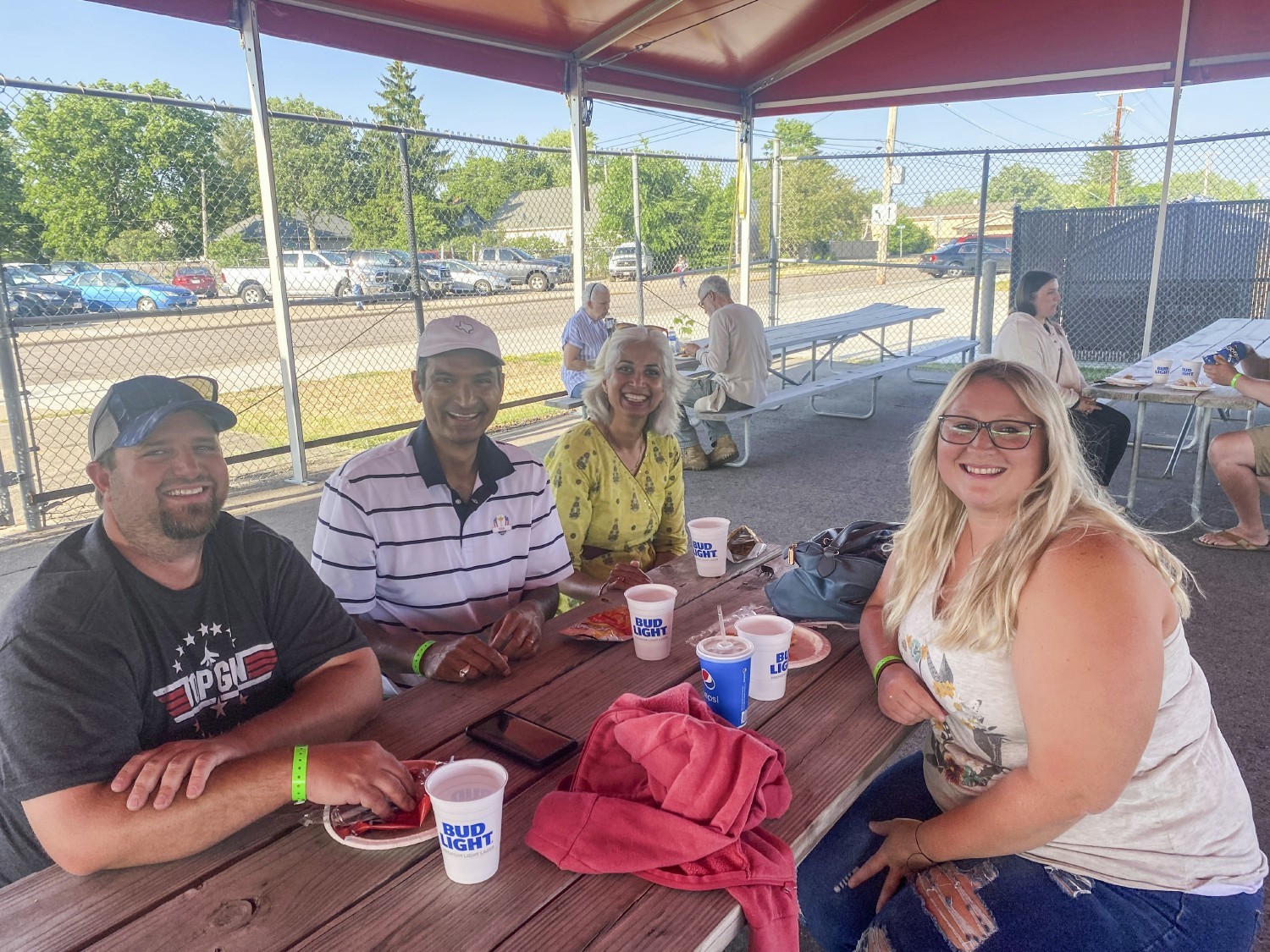 Team members hang out at our annual picnic at the Rafters game. 