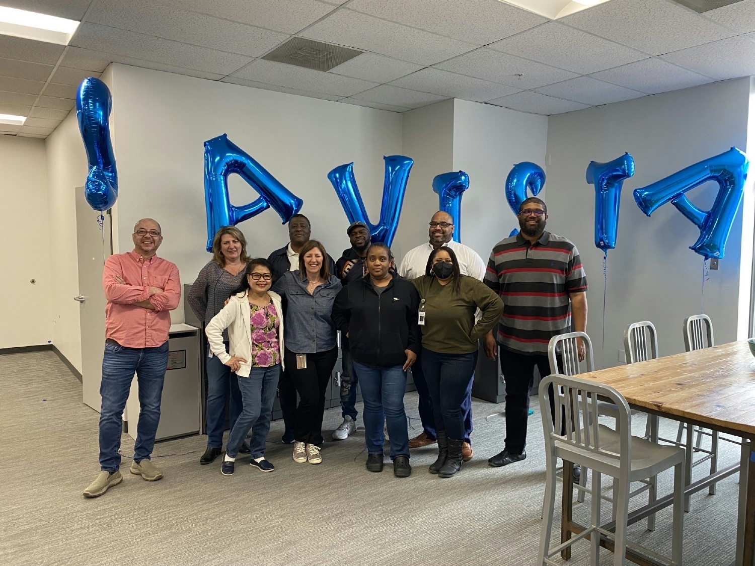 Colleagues and leadership set up and celebrate new office space in our Raleigh, NC office.