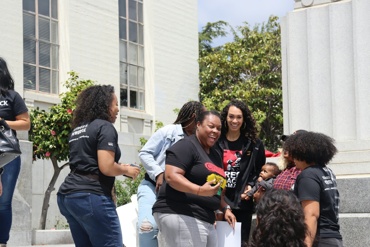 Essie members and staff outside of a Black Mama's Bail Out press conference.