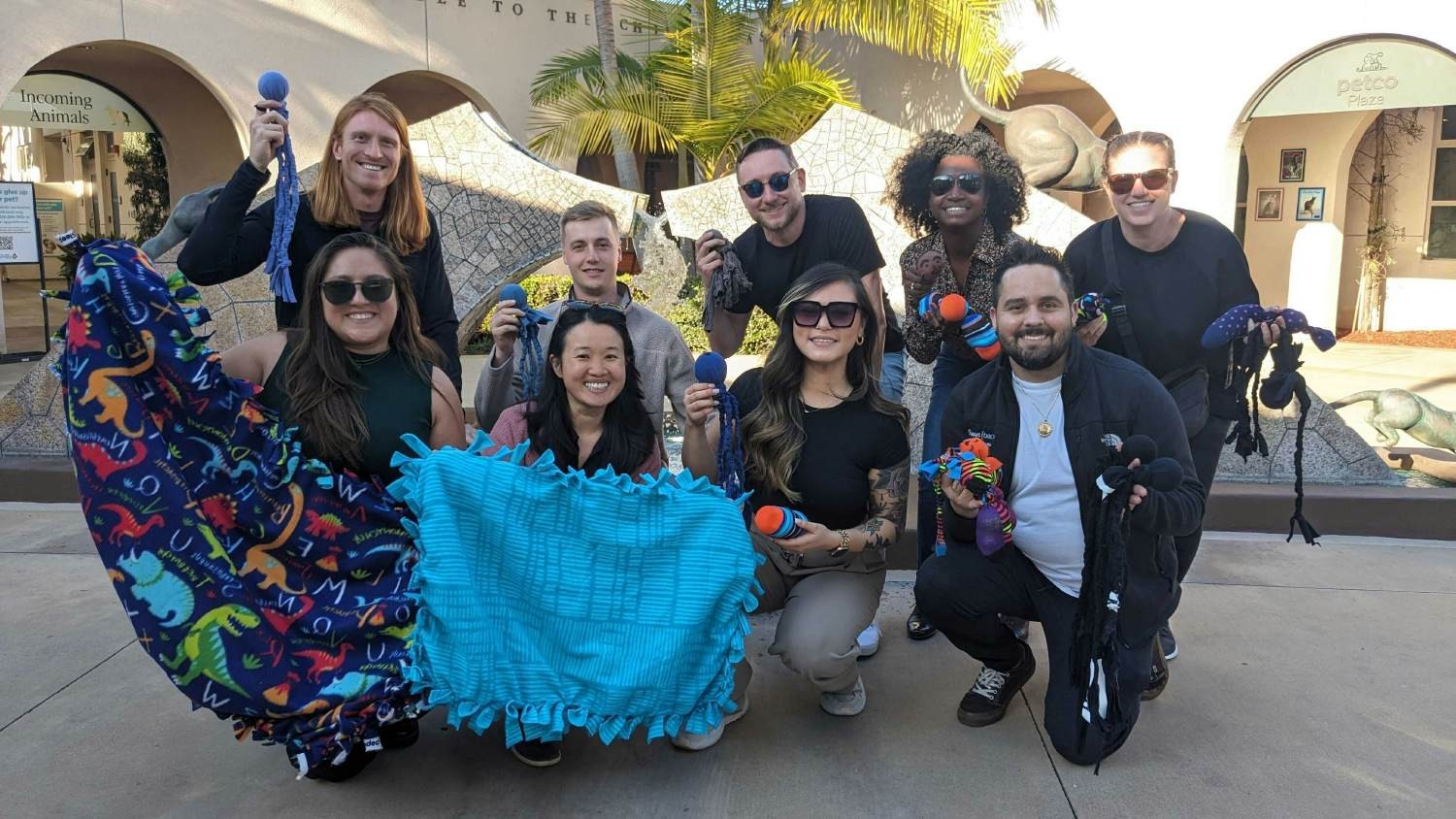 San Diego-based team members make toys for animals at the San Diego Humane Society. 