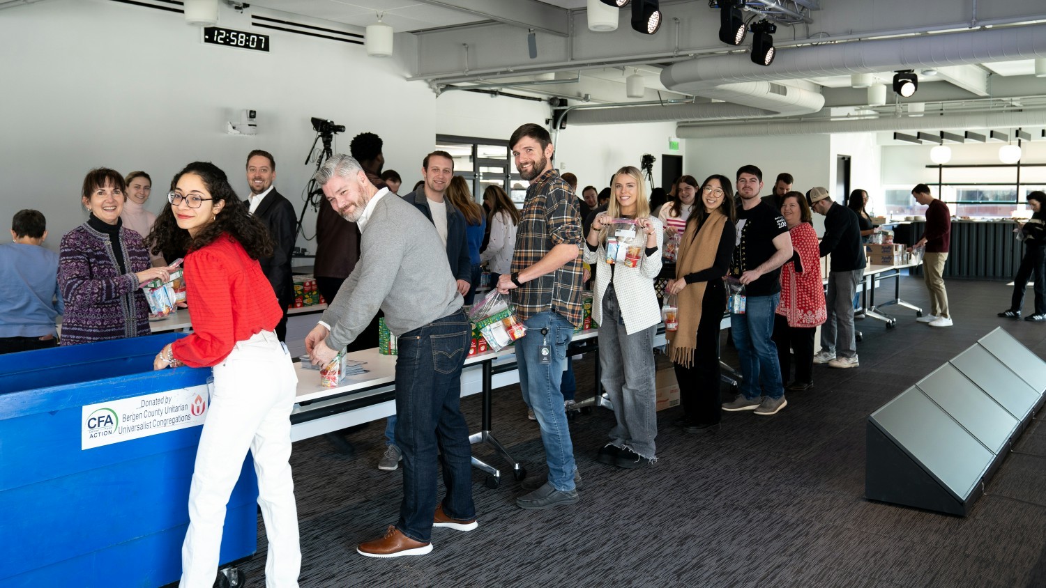 Colleagues at our New Jersey HQ create food packs for children facing food insecurity.  