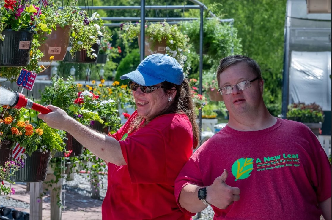 A New Leaf clients stay busy at the retail garden center watering in the hot spring and summer months!