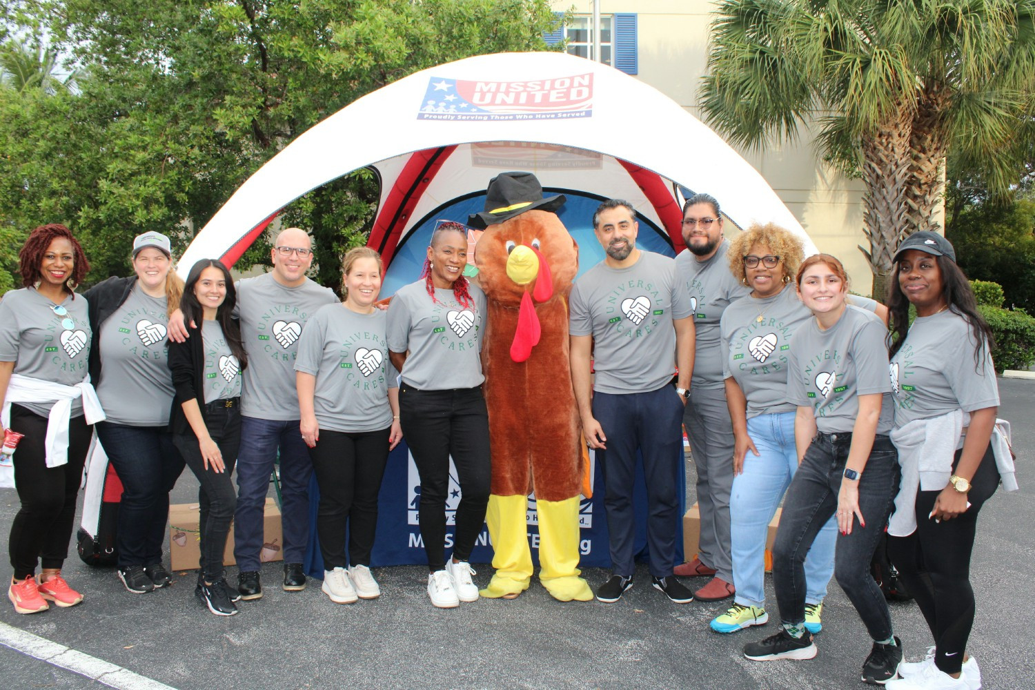 Universal employees help United Way of Broward at Operation Turkey, distributing food for veterans and their families. 