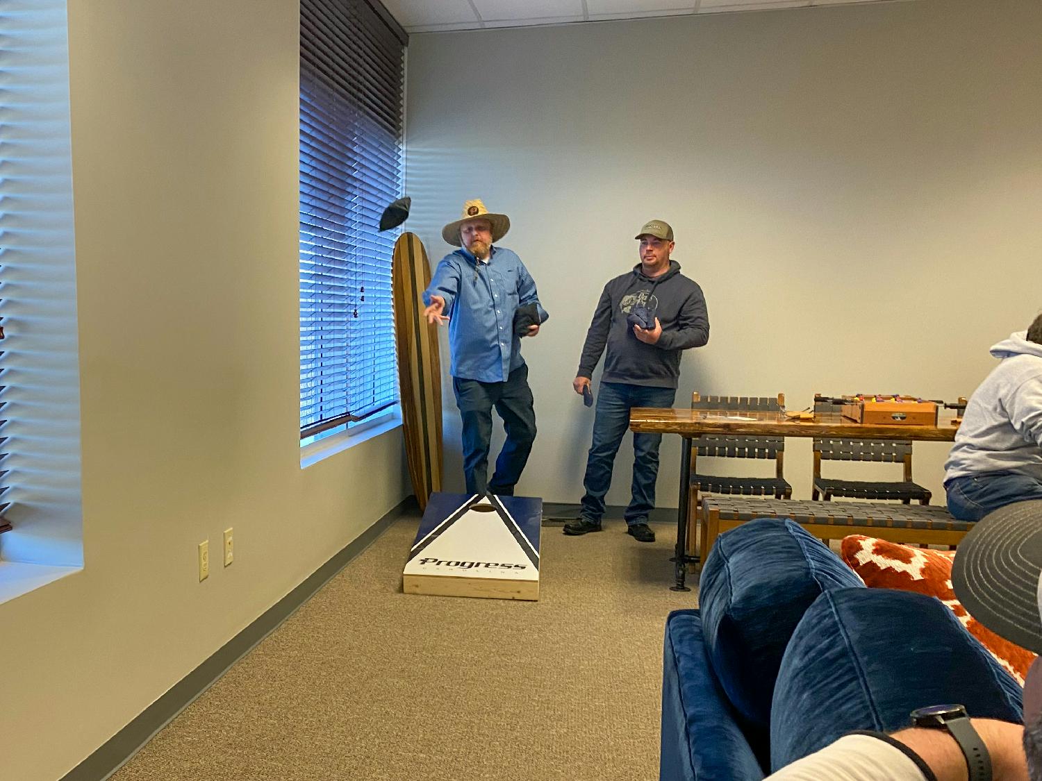 Friendly game of office corn hole