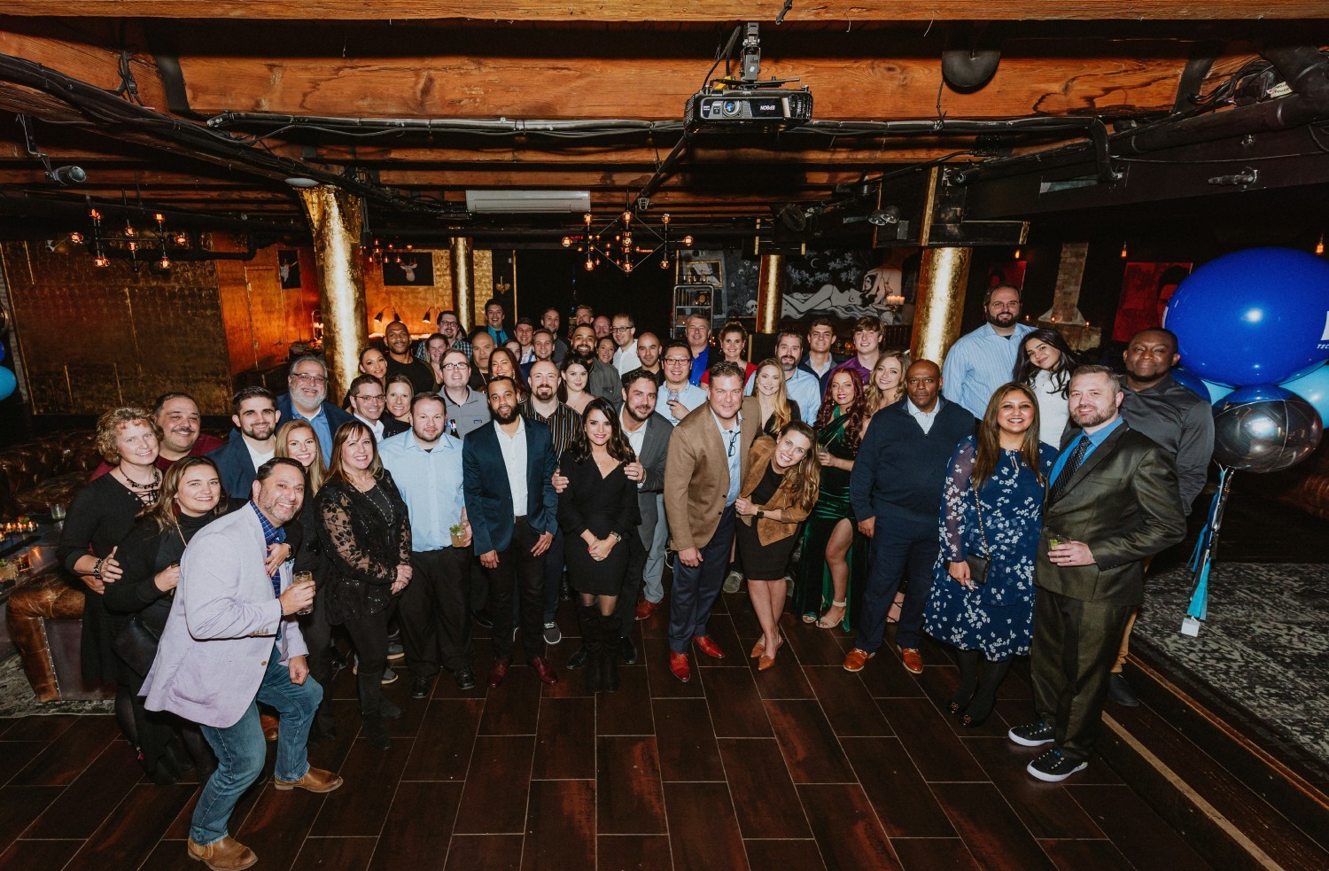 All company group photo from 2021 holiday party