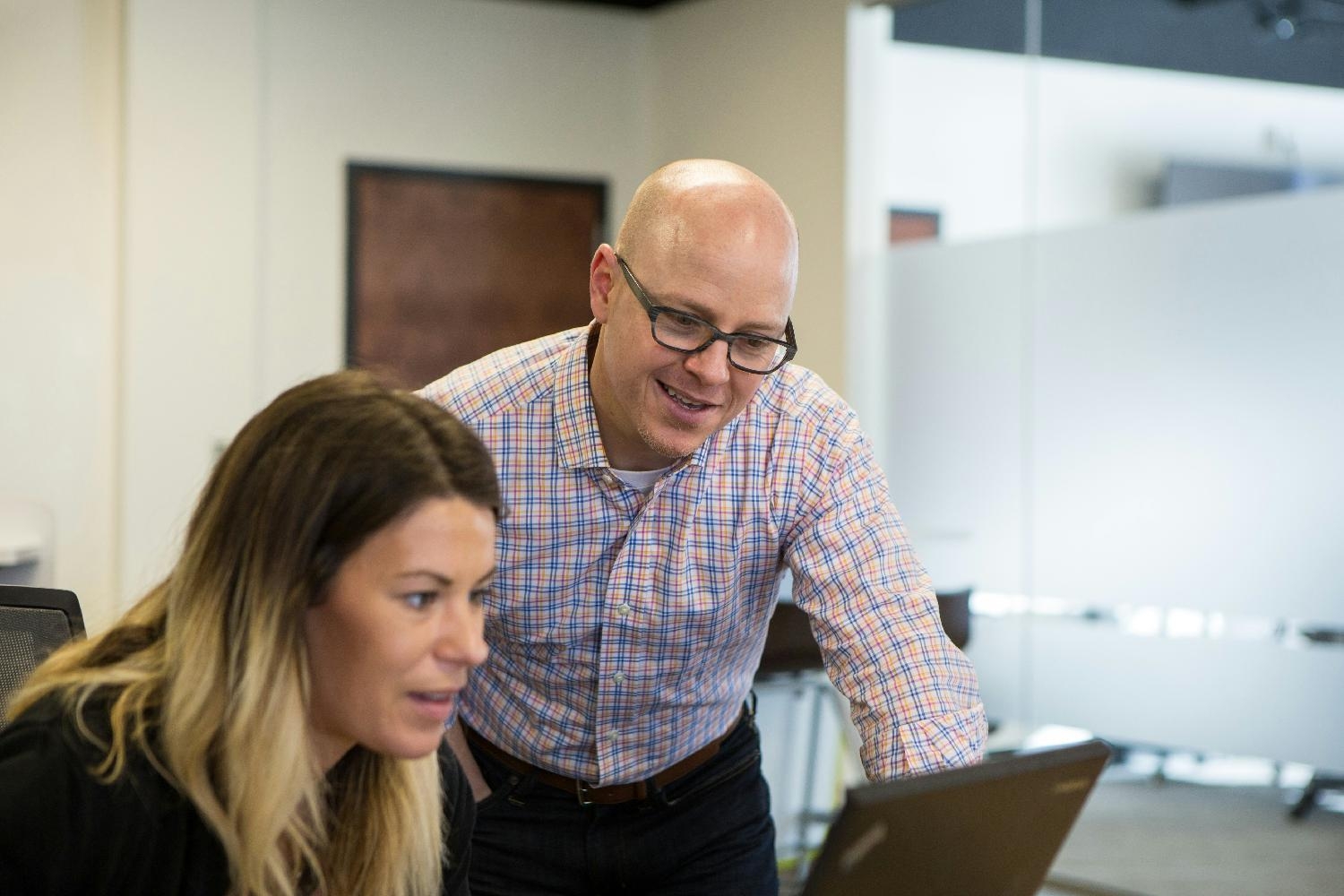 Enrollment Specialist, Robbie Woodson and Chief Customer Officer, Justin Lanning, working in the Tennessee Office