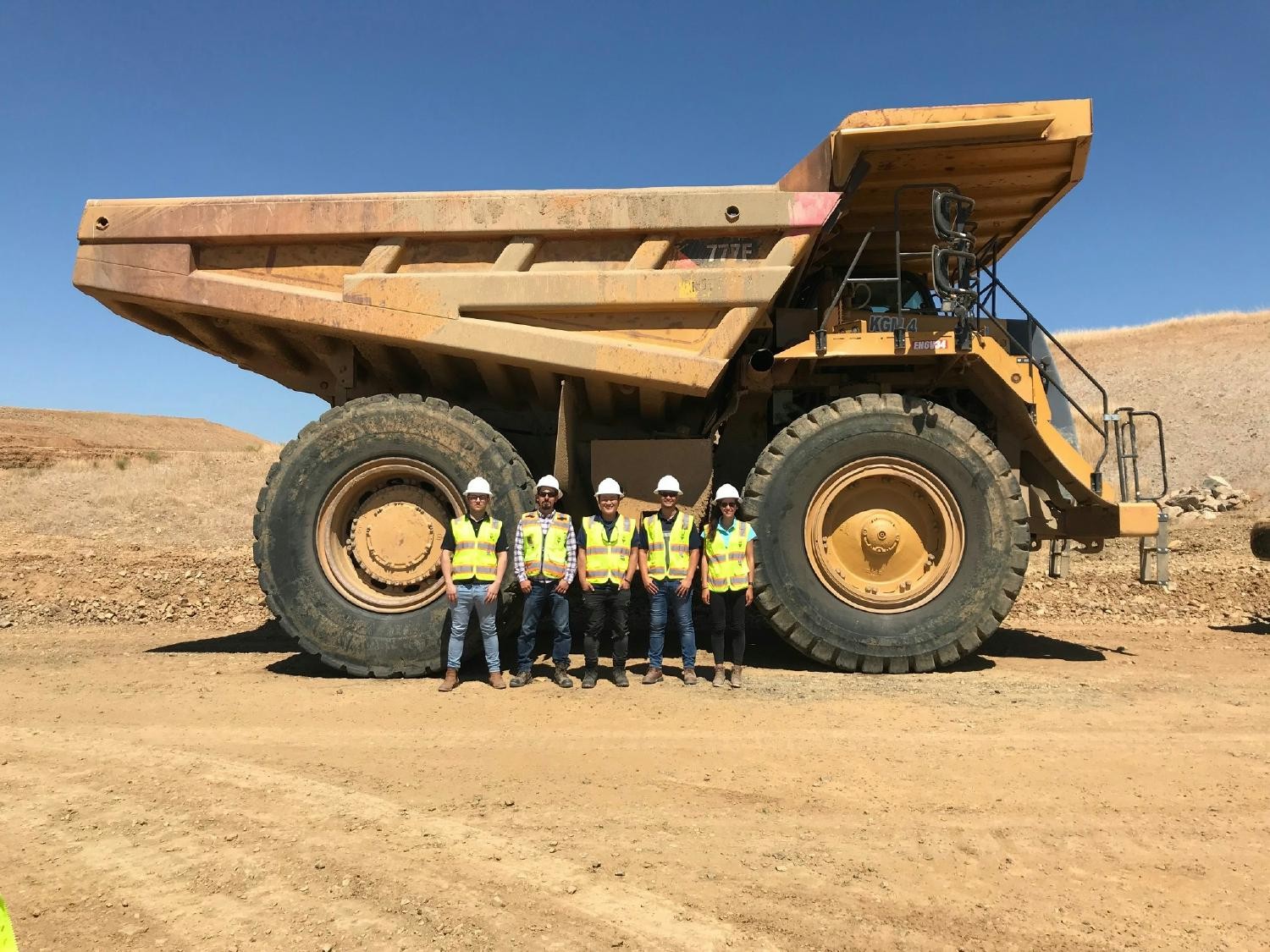 Picture of GBI employees in front of a large dump truck on an project in California