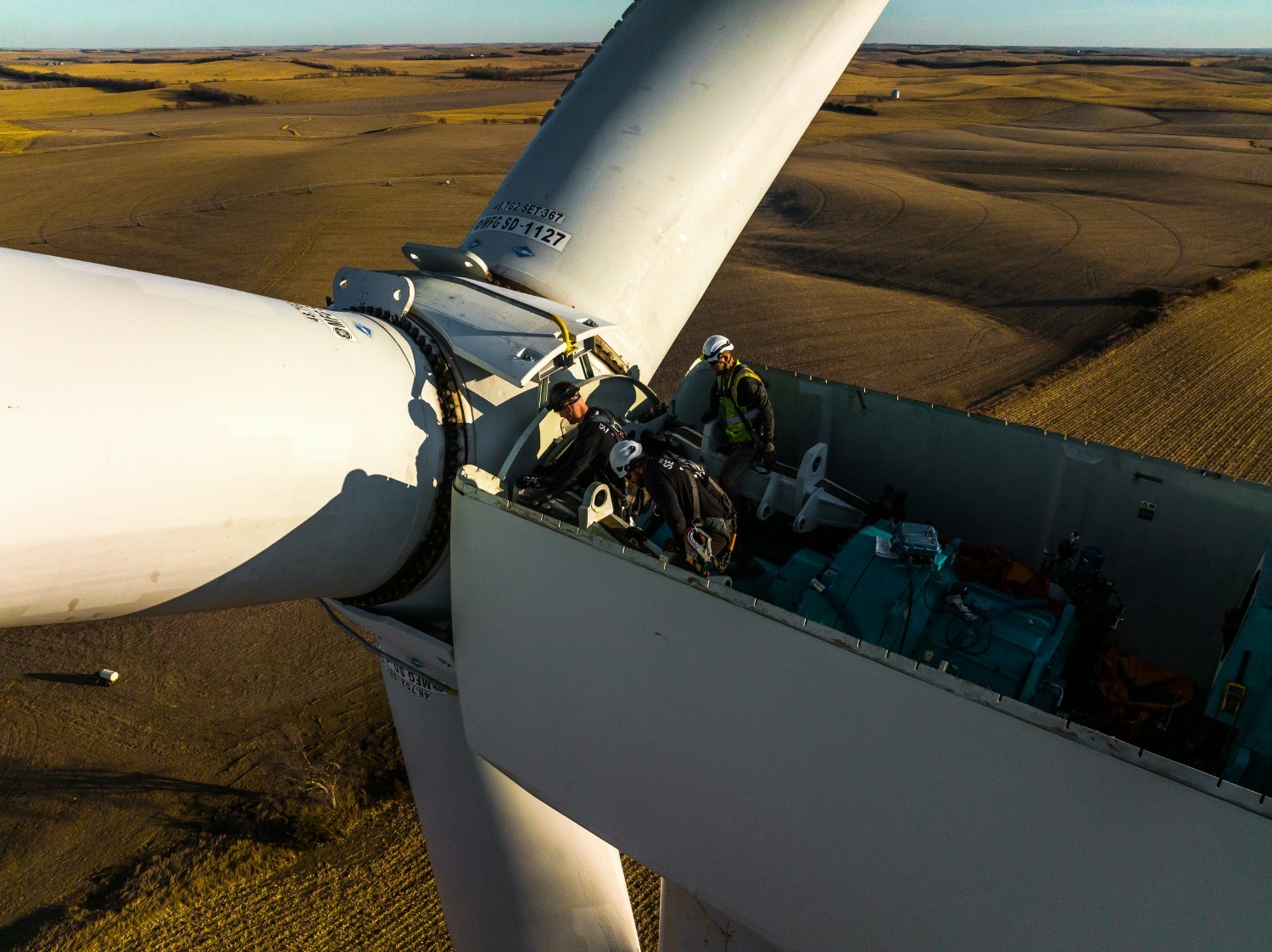 IEA employees repairing a gearbox rotor on a wind turbine in Nebraska. 