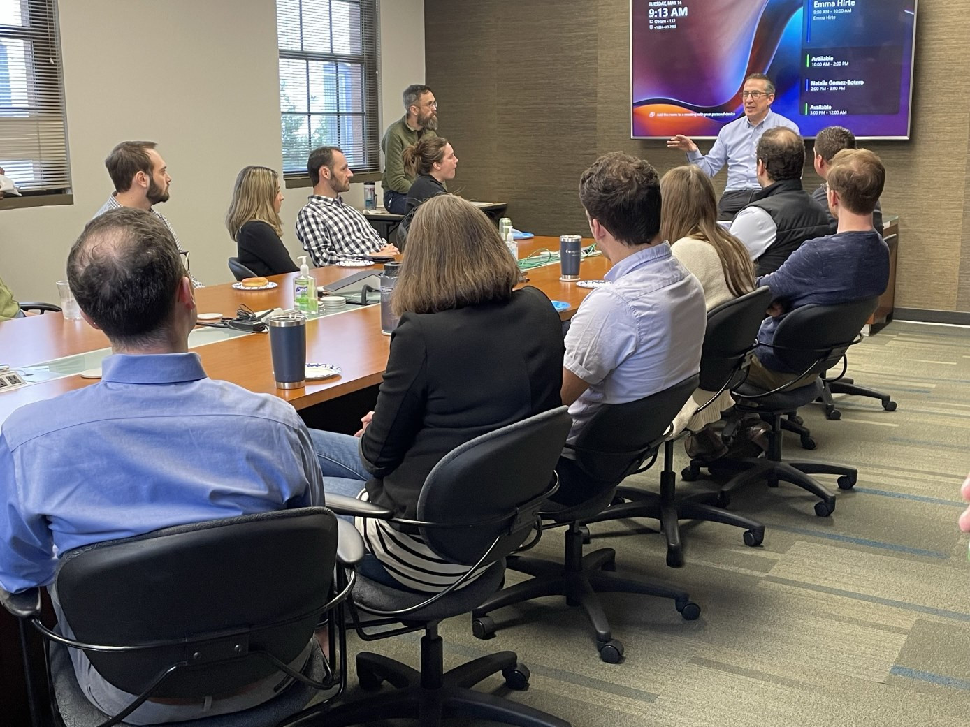 Beghou employees learning together through knowledge sessions.