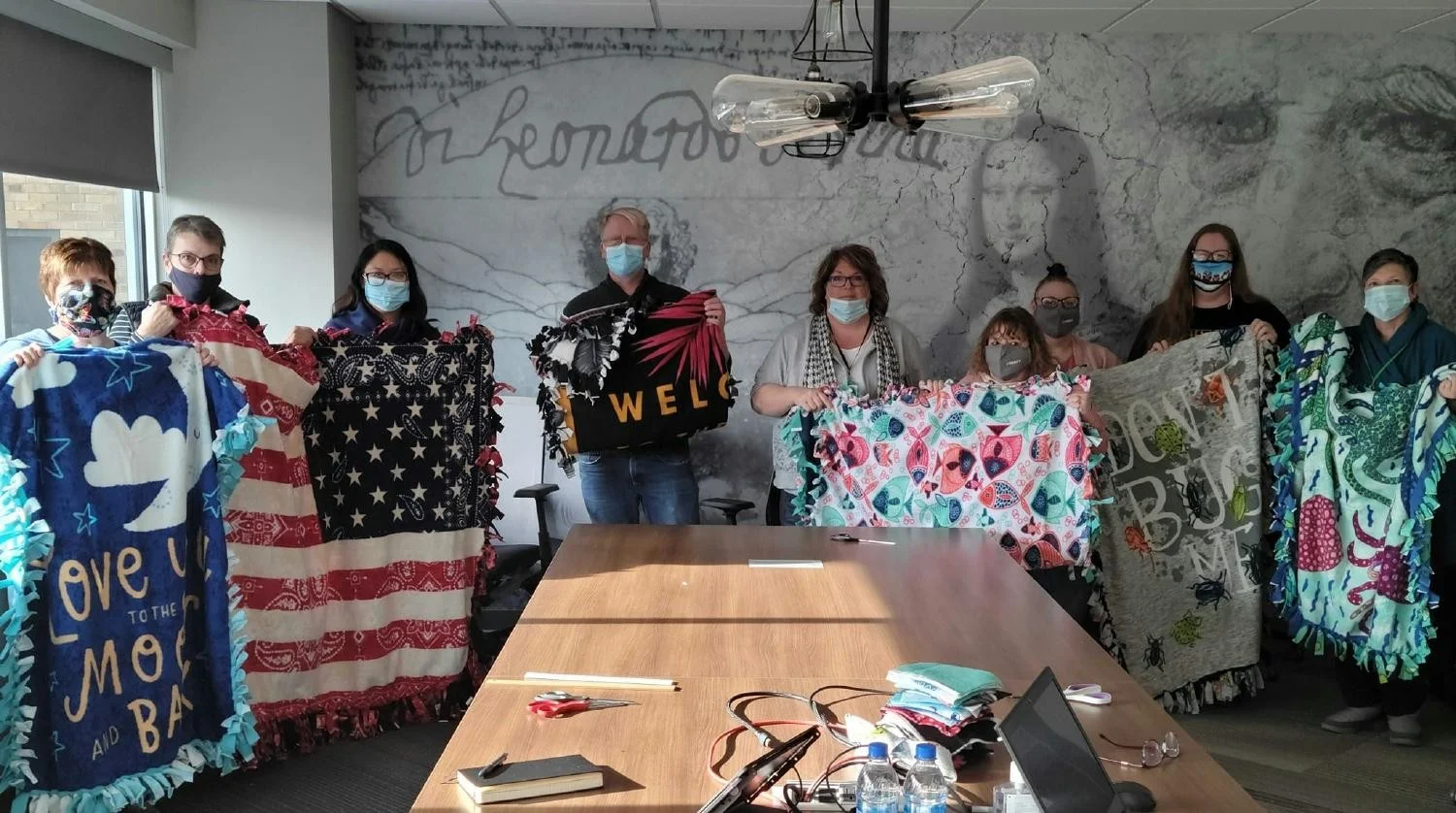 Teams used paid volunteer-time-off to make blankets for local non-profits during the pandemic. 