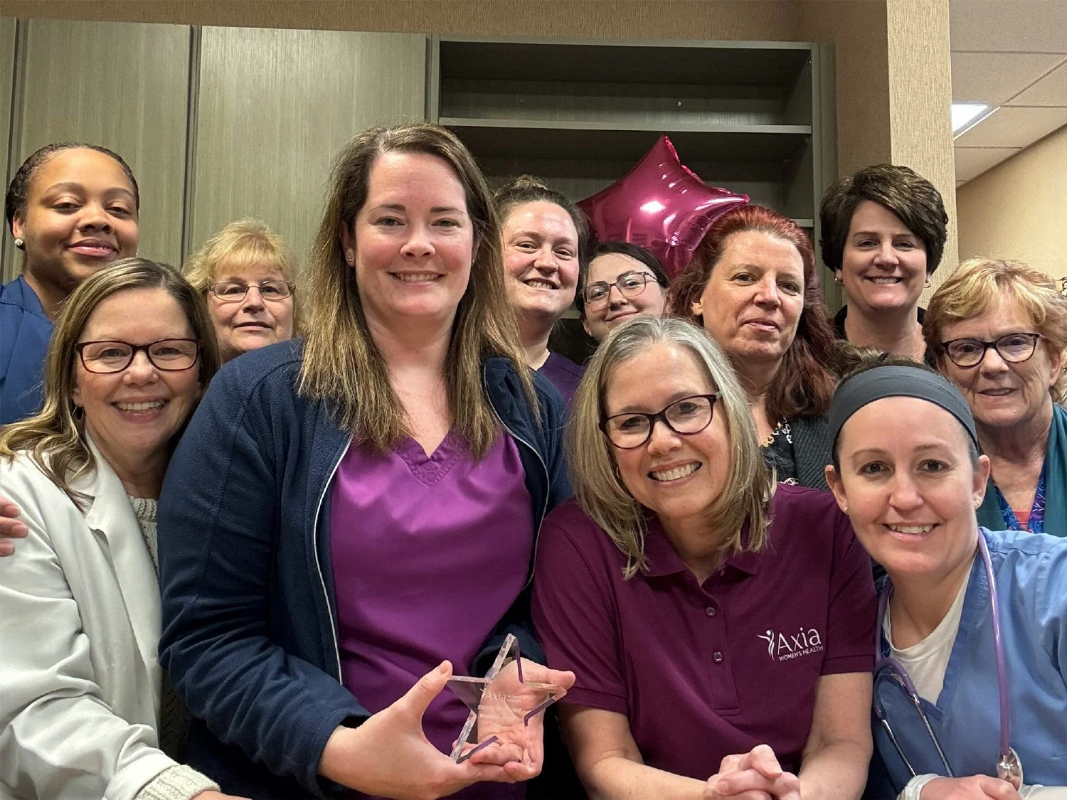 Axia colleagues celebrating their Shining Star award winner
