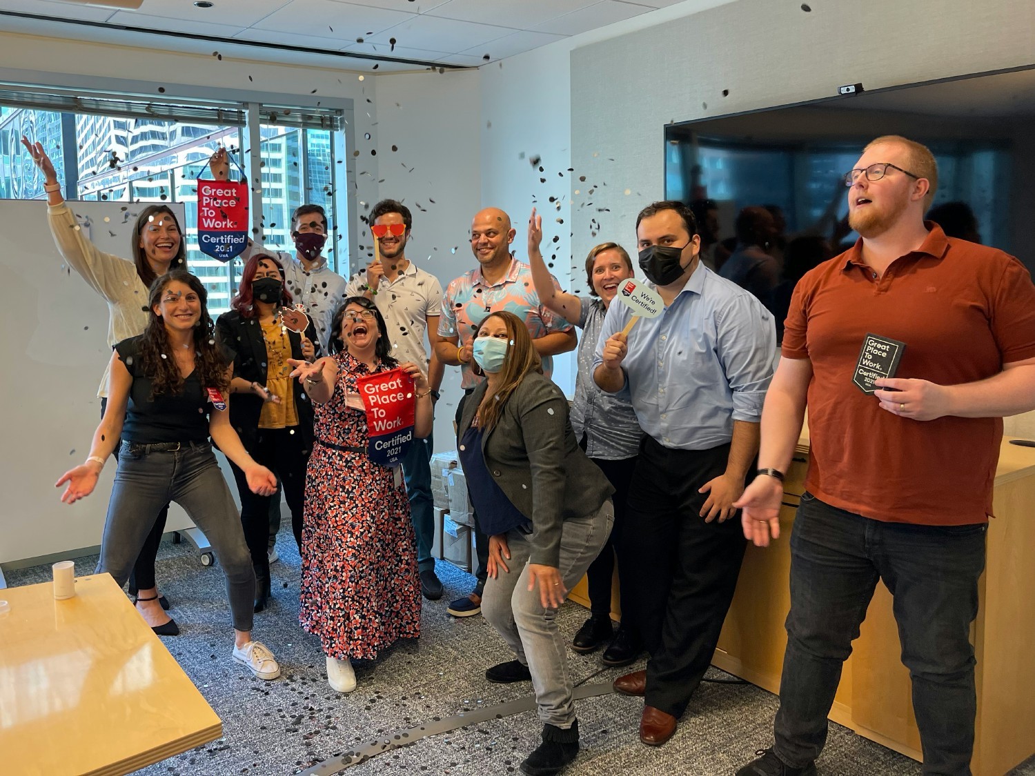 With a bit of confetti in the conference room, Credico's team celebrates its 2021 Great Place To Work® Certification™