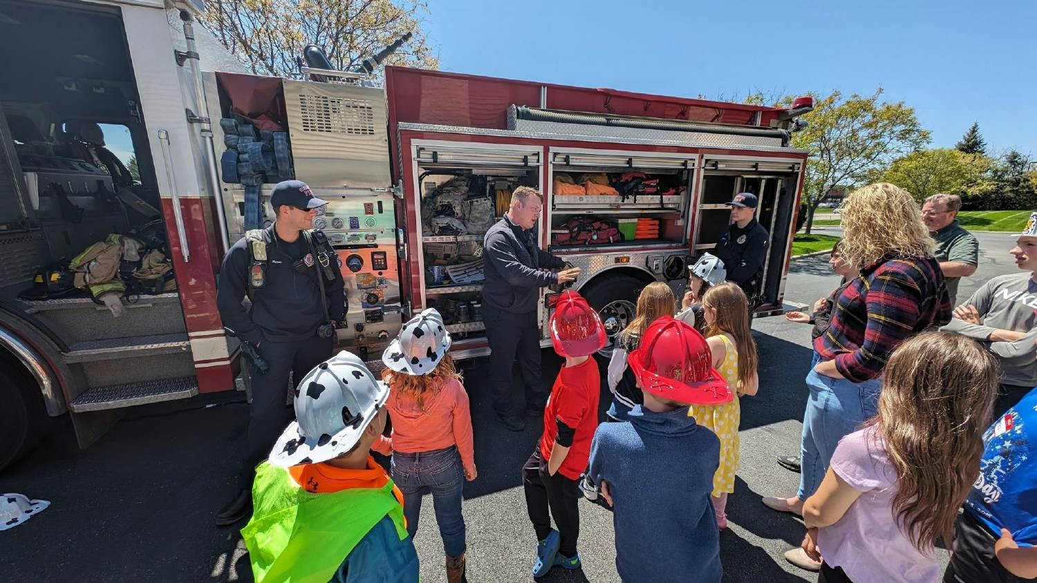 Our kids learning from first responders on Take Your Child to Work Day 2024.