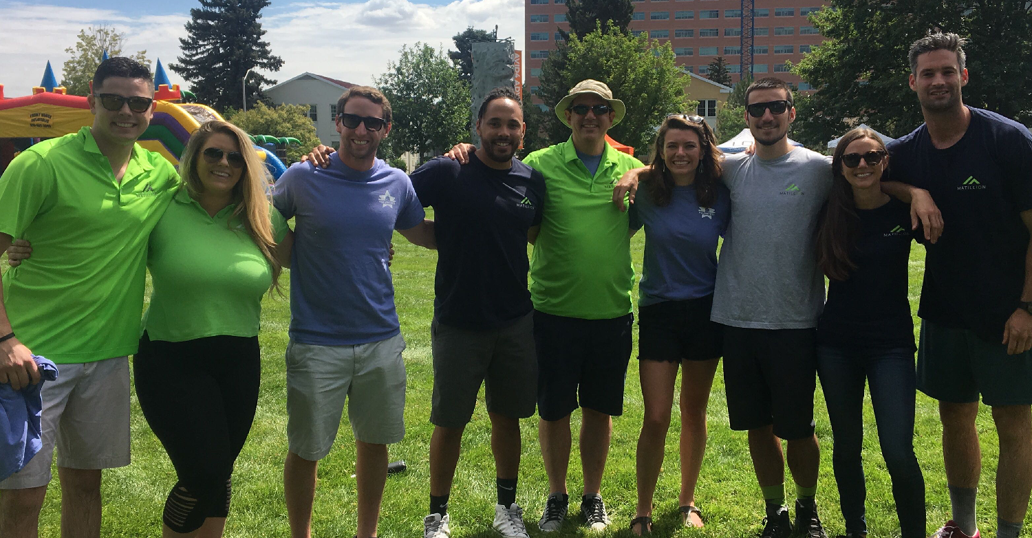 Team members at volunteeer day for local Denver charity.
