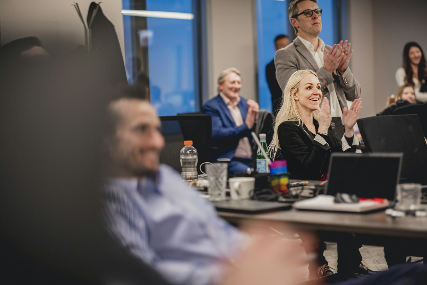 Colleagues in our Chicago office cheering for a sporting event.