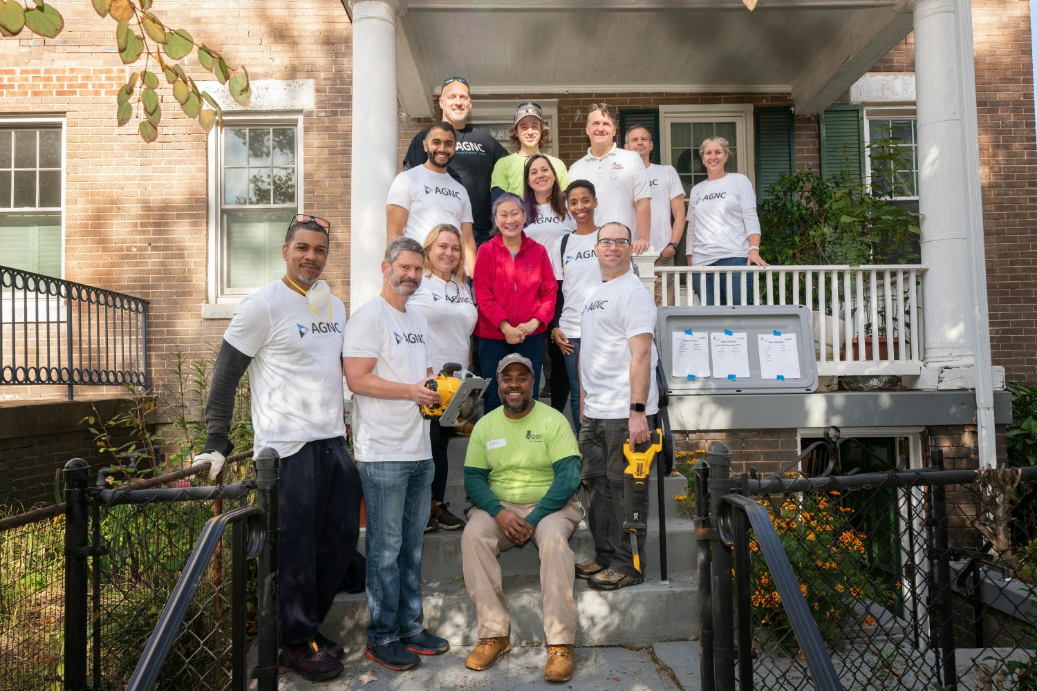 AGNC employees giving back to the community by providing critical home repairs for a low-income homeowner in DC.