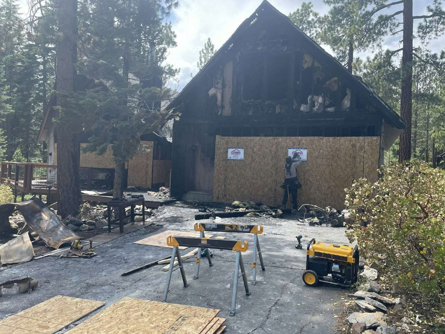 boarding up a house that burned