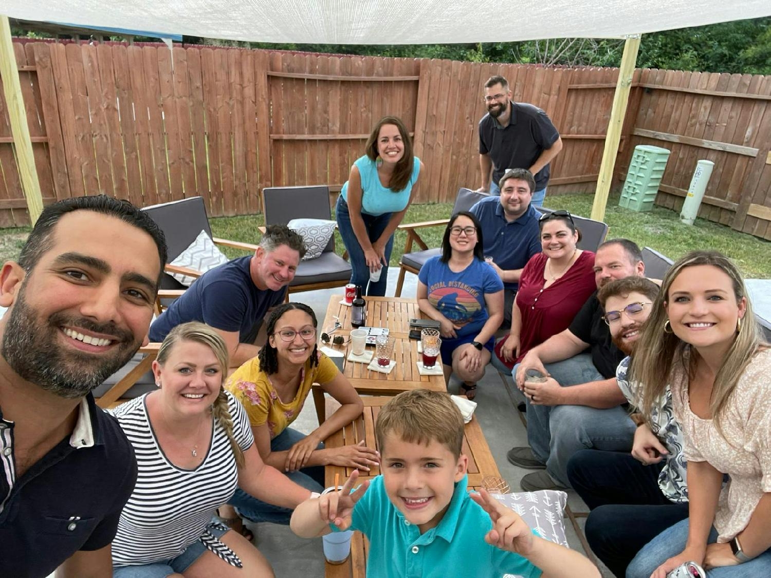 The AltruVista team and family enjoying great food and outdoor games together in the Summer of 2021
