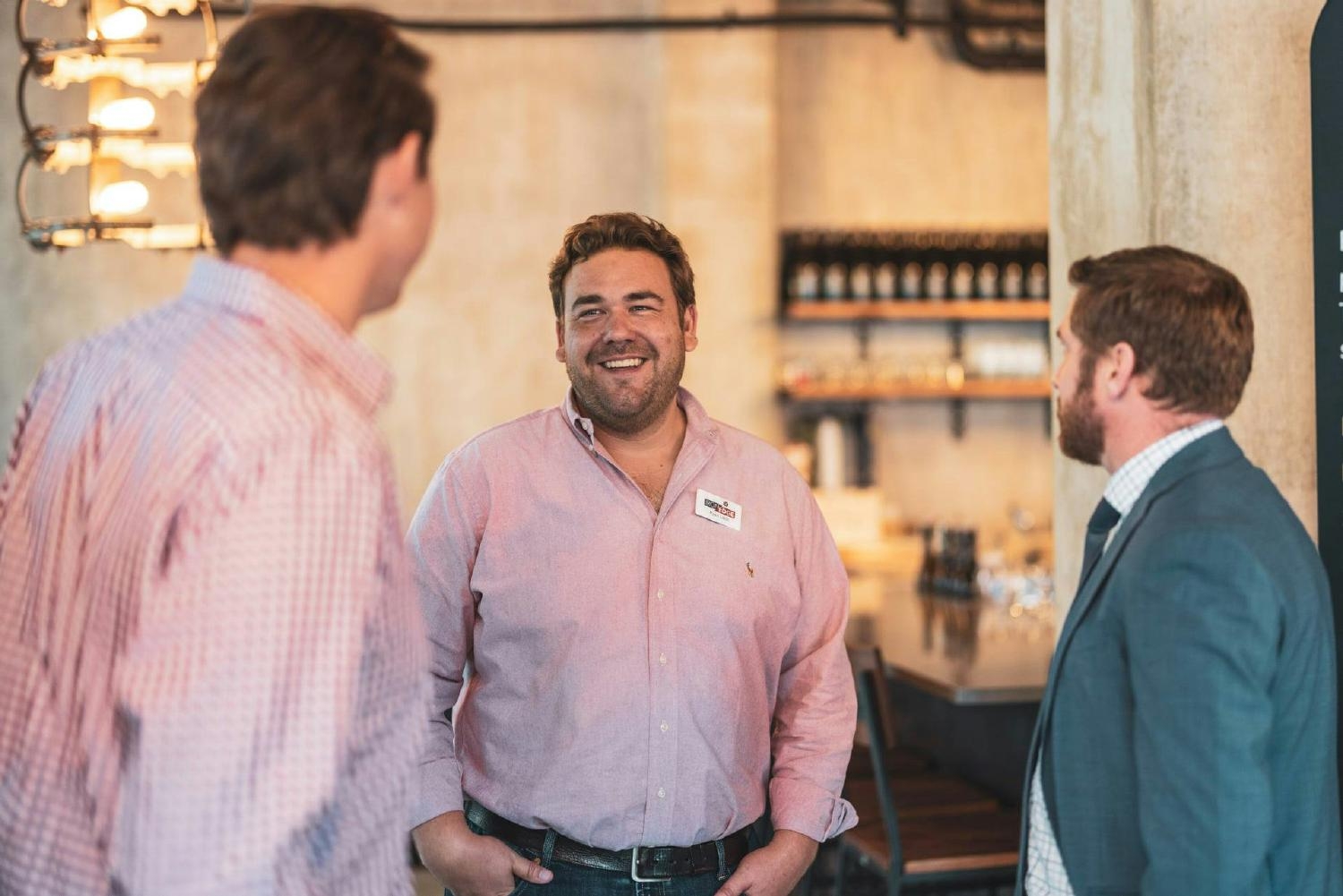 Ryan Lakin, President of IronEdge Group, converses with event attendees at a cybersecurity event hosted by IronEdge.