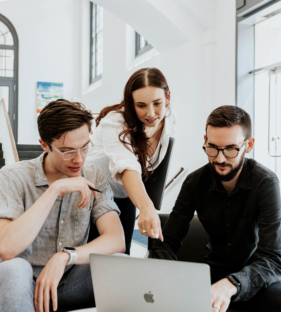 A few Web Team members getting to share a little in-office collaboration.