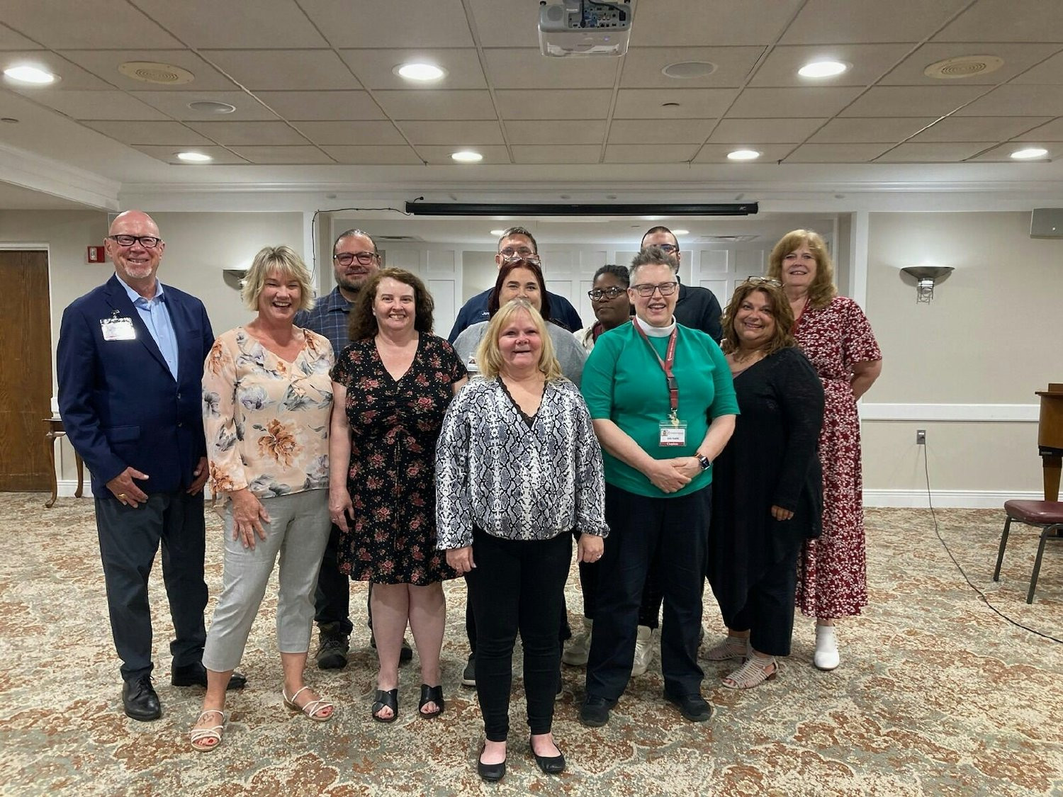 A joyful time at a ceremony recognizing employees who completed a group workshop program at Redstone